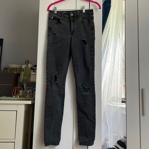 Skinny black Gap 1969 jeans. Stretchy, with holes. Size 27. Great condition.
